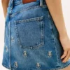 Allover-Crest-Minirock aus Denim mit hoher Taille Allover-Crest-Minirock aus Denim mit hoher Taille