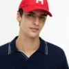 Baseballkappe mit H-Logo-Aufnäher Baseballkappe mit H-Logo-Aufnäher