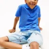 Kinder-Polohemd mit durchgehendem Flaggenprint Kinder-Polohemd mit durchgehendem Flaggenprint