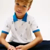 Kinder-Stretch-Polo mit durchgehendem nautischem Logo Kinder-Stretch-Polo mit durchgehendem nautischem Logo
