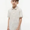 Kinder-Stretch-Polo mit tropischem Print Kinder-Stretch-Polo mit tropischem Print