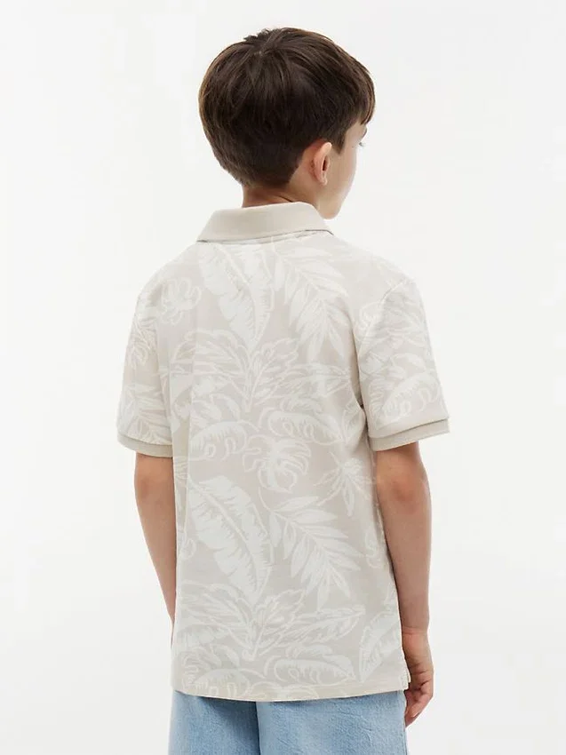Kinder-Stretch-Polo mit tropischem Print Kinder-Stretch-Polo mit tropischem Print