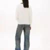 Tommy Jeans Pullover mit V-Ausschnitt und lockerer Passform Tommy Jeans Pullover mit V-Ausschnitt und lockerer Passform